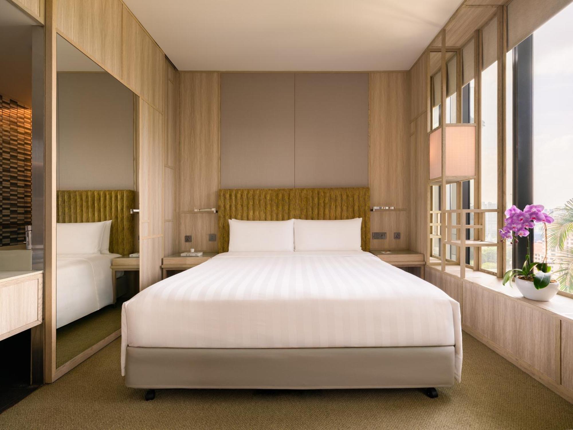 Parkroyal Collection Pickering, Szingapúr Kültér fotó A bedroom at the hotel